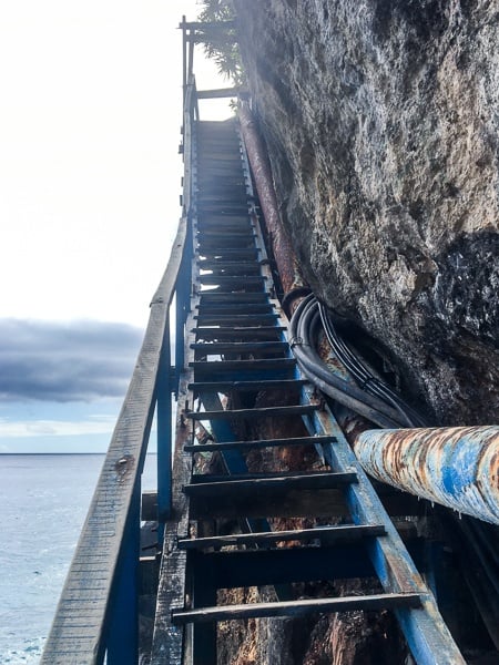 Steep old wooden stairway at Peguyangan Waterfall in Nusa Penida, Bali